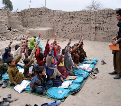 Afghan school children study at an open classroom in the outskirts of Jalalabad on January 30, 2013. Afghanistan has had only rare moments of peace over the past 30 years, its education system being undermined by the Soviet invasion of 1979, a civil war in the 1990s and five years of Taliban rule. AFP PHOTO/ Noorullah ShirzadaNoorullah Shirzada/AFP/Getty Images