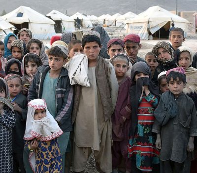 Children pose for photographs in front of their tents at a camp for internally displaced families in Panjwai district of Kandahar province on March 31, 2021. (Photo by JAVED TANVEER / AFP) (Photo by JAVED TANVEER/AFP via Getty Images)